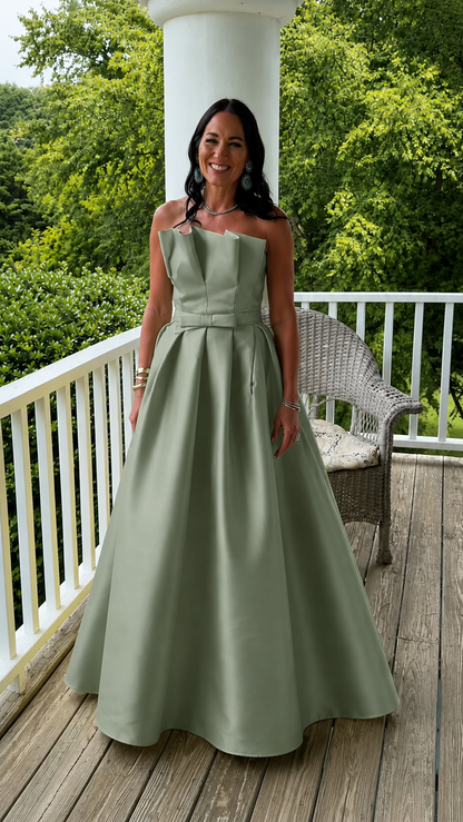 Front view of sage green strapless A-line full-length gown