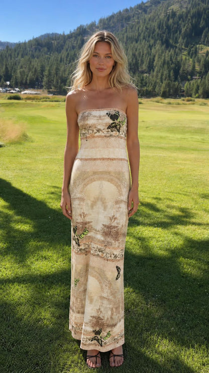 Model wearing beige color variant of the strapless maxi dress